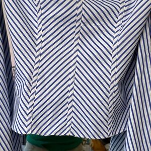 Beautiful Off Shoulder tiered fold Sleeves creating a fun stylish look. Fitted.